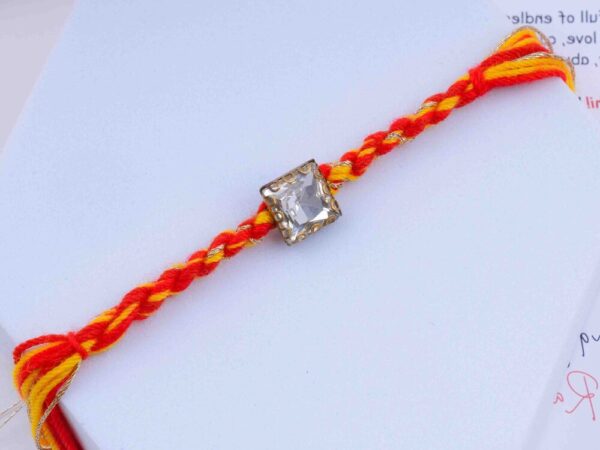 Regal Sparkling Fancy Embellished Rakhi in Red and Yellow Multi Strands