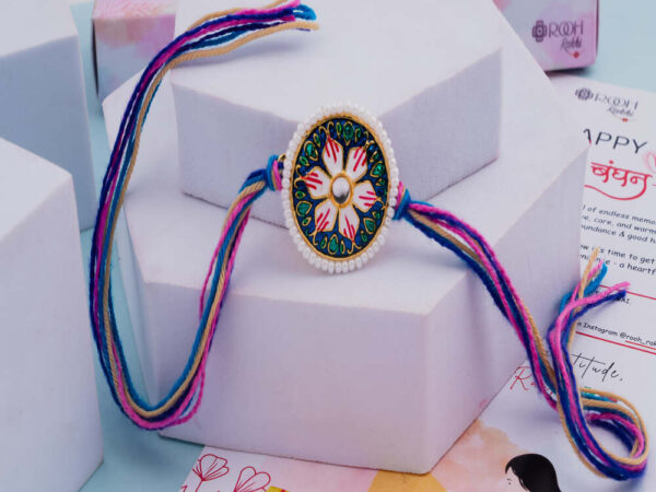 Meenakari Rakhi with Floral Motif & Pearl Border