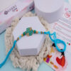 Turquoise Designer Rakhi with Enamel Charm
