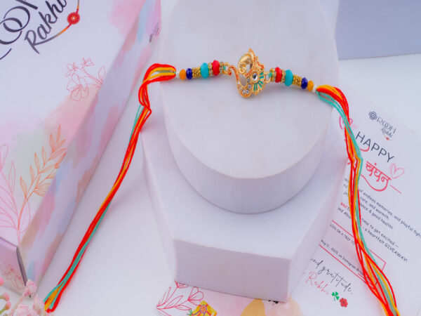 Om and Ganesha Rakhi Online - Multicolored
