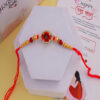 Rich Red Om Crystal Rakhi Online