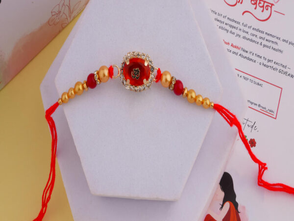 Rich Red Om Crystal Rakhi Online